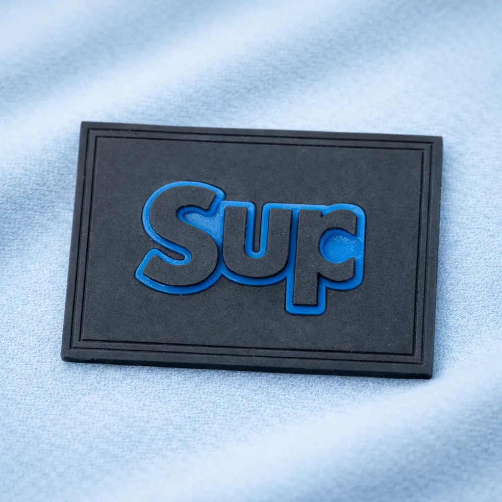RL-3379 embossed rubber label for garment branding